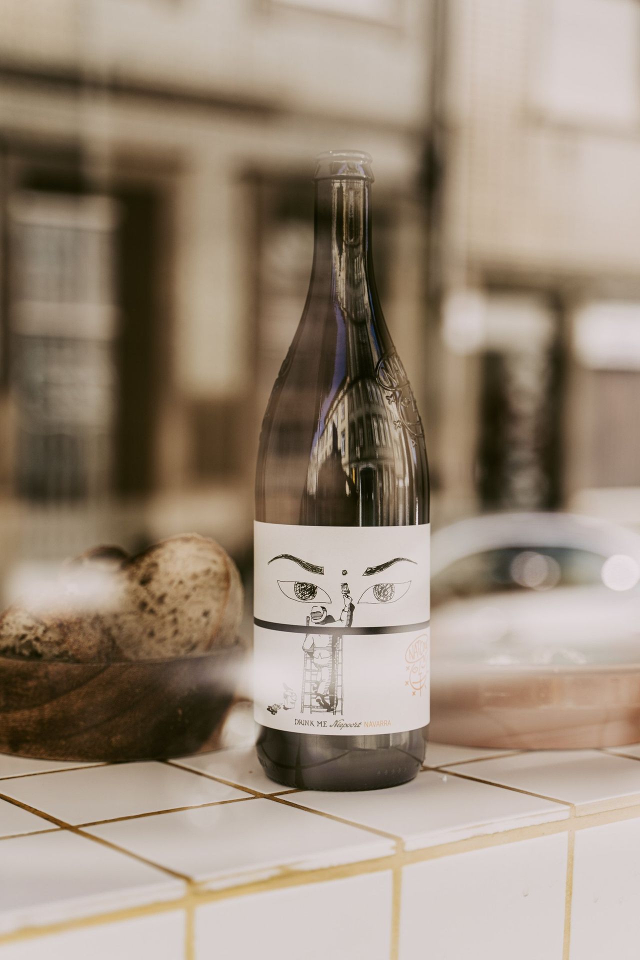 A bottle of Niepoort on a tiled counter